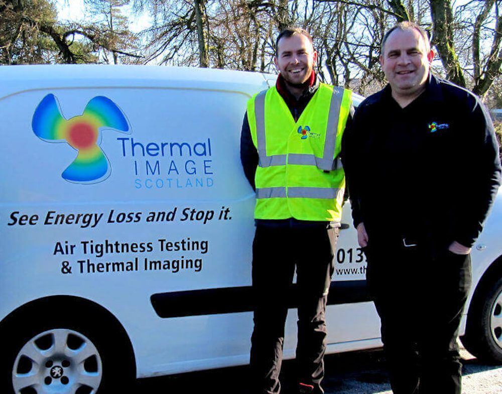 Two members of the Thermal Image UK team standing beside a van lettered with the company name and the line See Energy Loss and Stop It